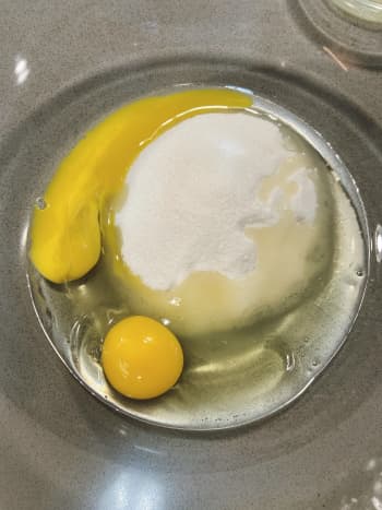 In a large bowl, combine the sugar and eggs. Whisk until they are well combined.