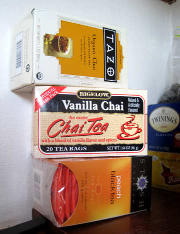 We keep spare boxes of tea stacked in the pantry.