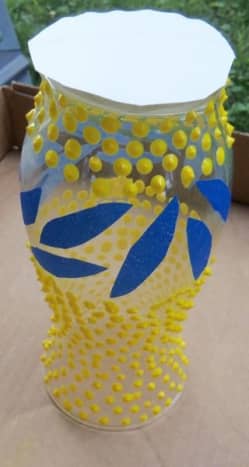 I turned the vase upside down and cut a ring out of a paper plate to prevent the bottom from getting paint on it. Mind you, a real hobnail milk glass piece is painted on the bottom.