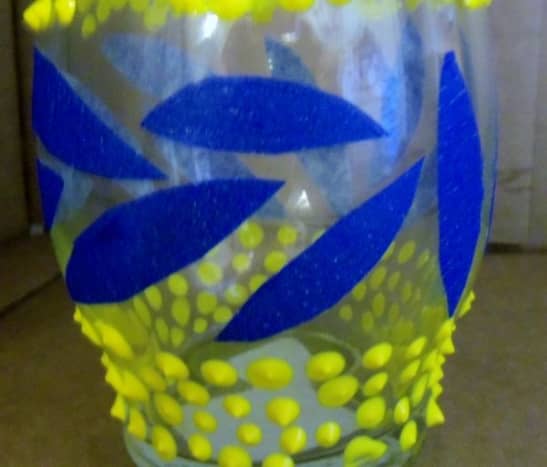 I wanted to be able to see the stems through the bottom of the vase, so I cut leaves out of painter's tape.