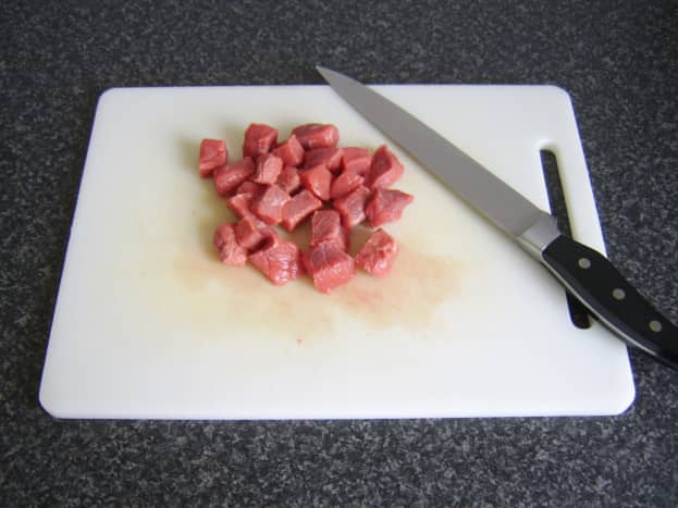 Pieces of topside of beef are cut to approximately three-quarters of an inch cubes