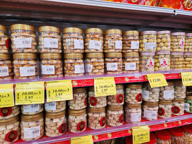 &ldquo;Chinese New Year cookies&rdquo; at a Singaporean festive bazaar. Such cookies come in a variety of sweet flavors and are usually around one inch wide. They are always sold in plastic jars with red lids too.