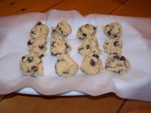 Put chocolate chip cookie dough balls on a plate lined with parchment paper if you have any (for easy removal) and put in the freezer for about 20 minutes before sealing them.