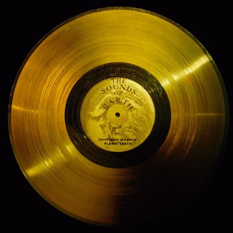 Flying aboard Voyagers 1 and 2 are identical &quot;golden&quot; records, carrying the story of Earth far into deep space. The 12-inch gold-plated copper discs contain greetings in 60 languages, samples of music from different cultures and eras, and natural and