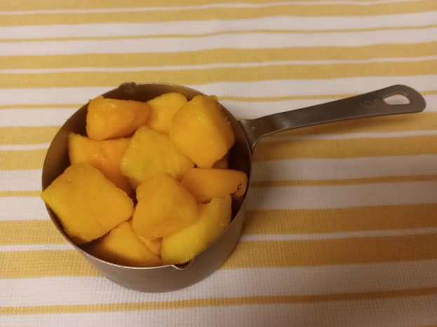 Measure 1 cup of mango chunks. I buy mine frozen at Trader Joe's.