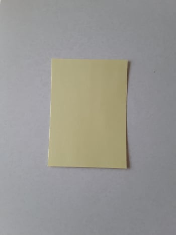 A very small square of thin cardstock.
