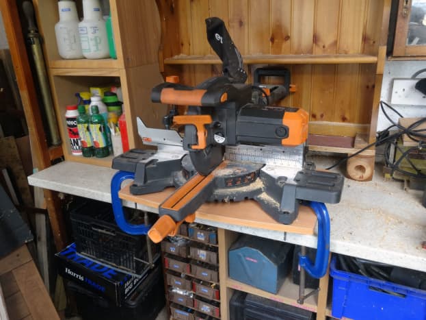 Rear clamps hold the saw to the platform, and front clamps holding the platform to the workbench.