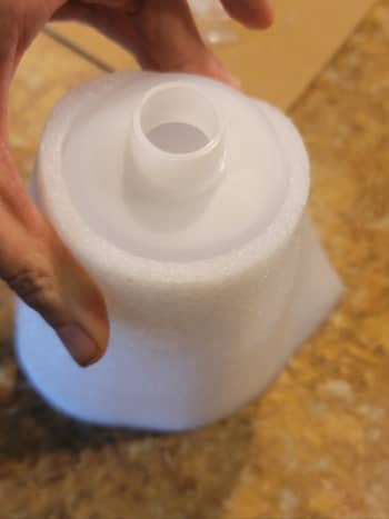 Wrap a piece of your Styrofoam packing around your bottle to size it. 