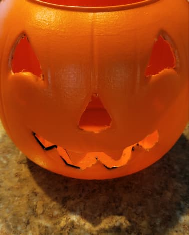 Cut eyes, nose, and mouth from pumpkin.