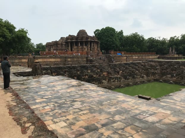 I tried to capture a complete view of the Sun Temple complex&mdash;the Kund followed by the Sabhamandapa and the Gudhamandapa&mdash;the main shrine temple behind it. On the farther northern end, two other pillars are also seen.