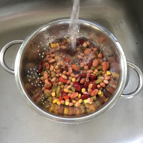 Washing impurities from canned beans
