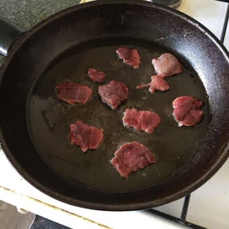 Frying goose breast slices