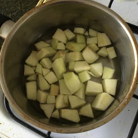Chopped apple, water and sugar is brought to a simmer