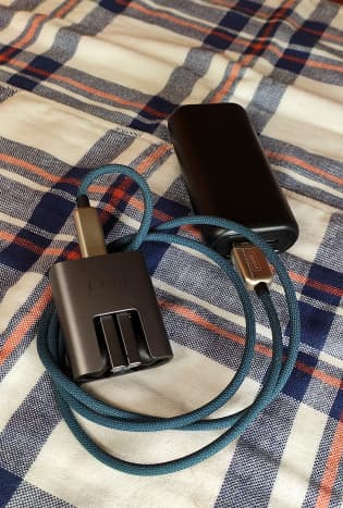 View of the 10000mAh power bank charging my earbud set