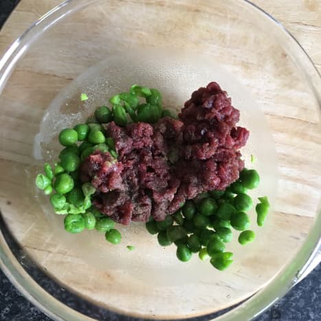 Chopped pigeon breast is combined with crushed peas