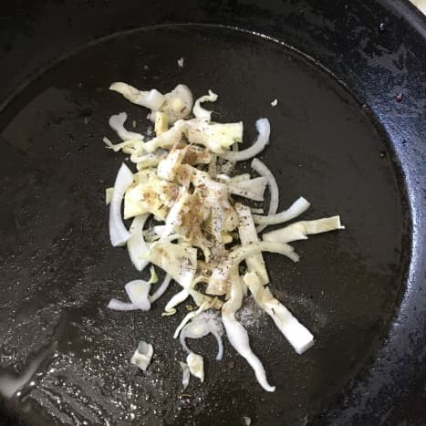 Flash frying cabbage and onion