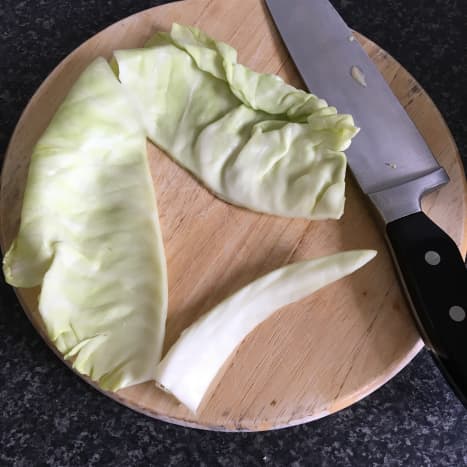 Core is removed from cabbage leaves