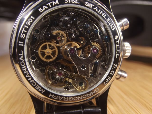 The watch's wind-up mechanical movement can be viewed from the rear of the timepiece