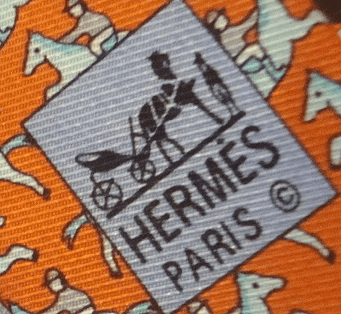 Look at the twill direction.  It is not running 11 to 5.  It is more East-to-West than a genuine Herm&egrave;s tie.