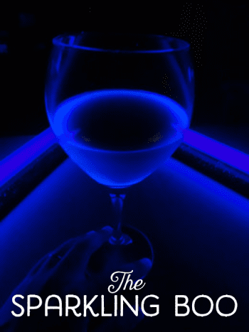 The drink glows a bright blue because of the tonic water.