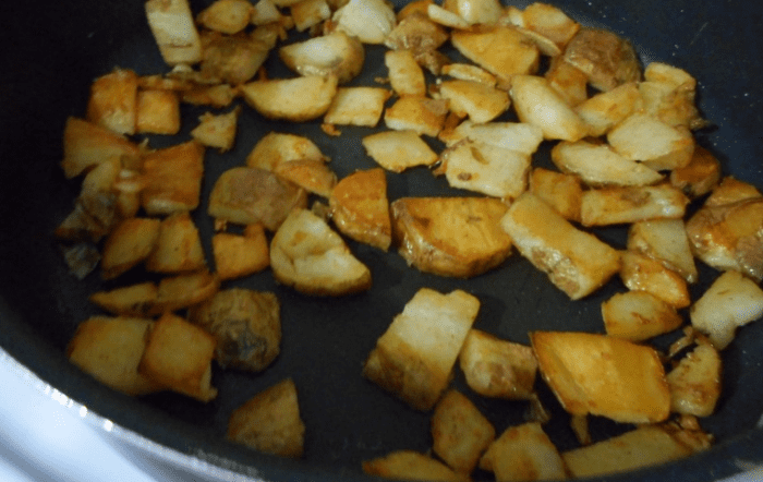 Three baked potatoes, sliced up into quarter thick pieces