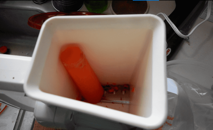 minnesota-cooking-carrots-using-a-salad-shooter-to-grate