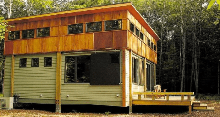 In this installed Ready Structures cottage, the exterior features fiber cement board (low maintenance), full-width wood deck, and plenty of windows.