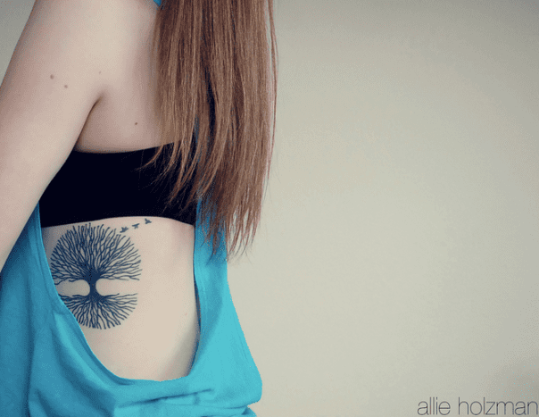 A full tree tattoo with roots