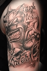 An example of a &quot;laugh now, cry later&quot; arm tattoo.
