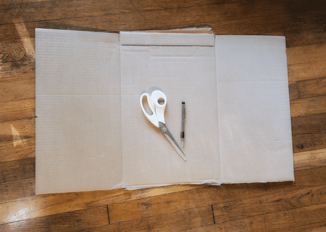 Lay out your cardboard. Size based on where you will hang your crescent moon. 