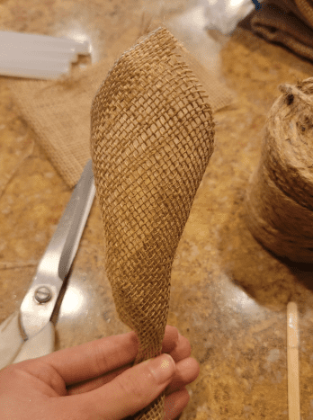Cut four rectangles from your burlap. Roll them into loose cones to create wings.