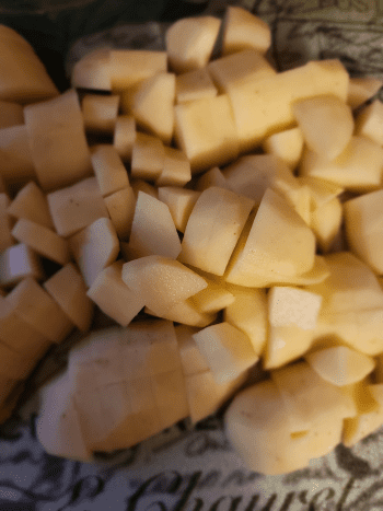 Wash, peel, and chop potatoes. 
