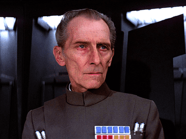 Peter Cushing as Grand Moff Tarkin in Star Wars.  His image was used to reprise the Moff Tarken character in Rogue One