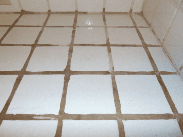This is the tile in my kitchen. Chunks of grout was missing, and the tiles were chipped everywhere.