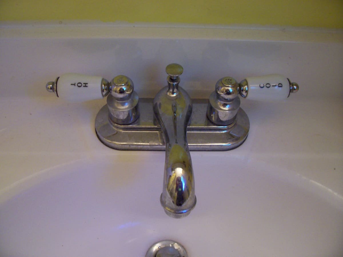 repairing a leaky bath faucet