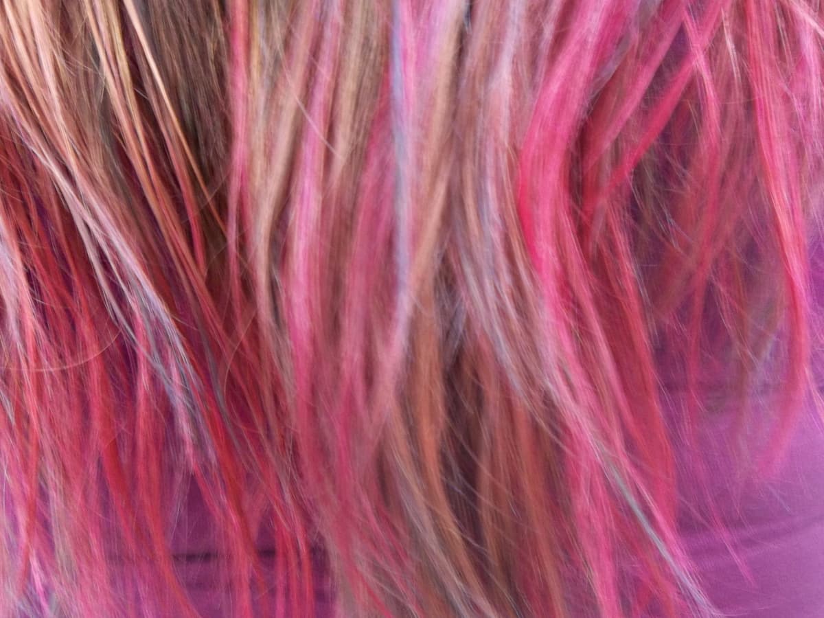 Closeup side view of hair foils during hair color and highlight