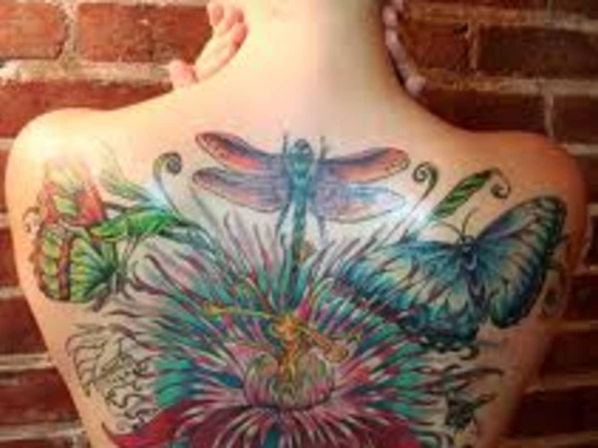 dragonfly with flowers chest tattooTikTok Search