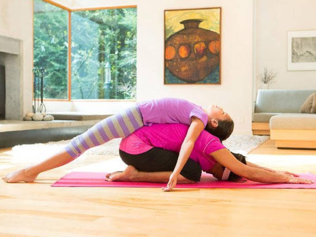 5 Couples Yoga Poses To Strengthen Your Relationship | mindbodygreen