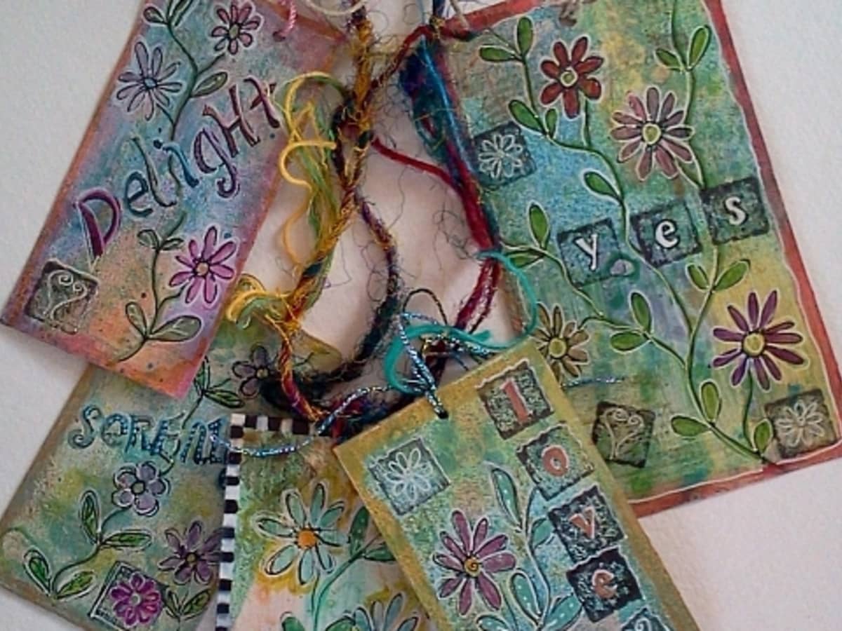 Recycle clothes tags into small art pieces - mixed media style