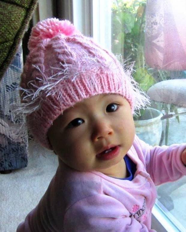 how-to-knit-a-baby-hat-with-double-pointed-needles-pink-cabled-baby-hat-free-knitting-pattern