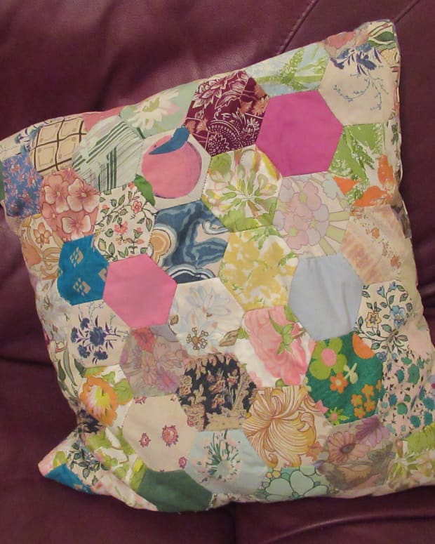 family-history-in-an-object-patchwork-cushion-of-family-fabrics-and-furnishings-for-the-famous