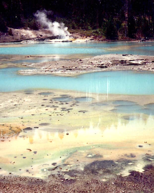 Colorful pools of water with steam rising