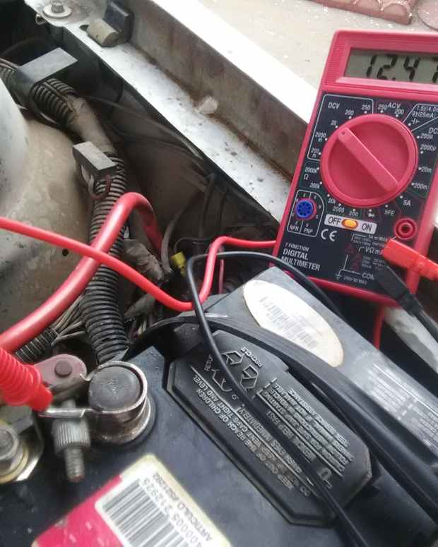 How to Test a Car Battery With a Multimeter or Hydrometer AxleAddict