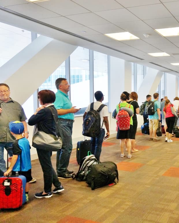 Passengers waiting in a long TSA check-in line
