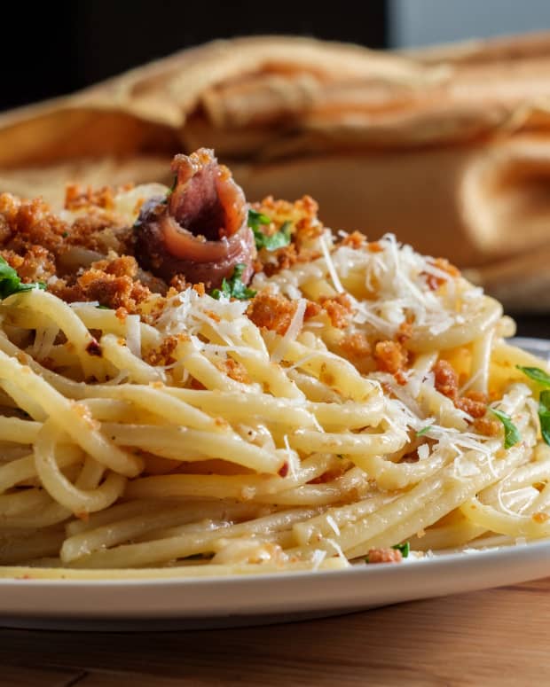An enticing plate of spaghetti pasta mollicata on a wooden table