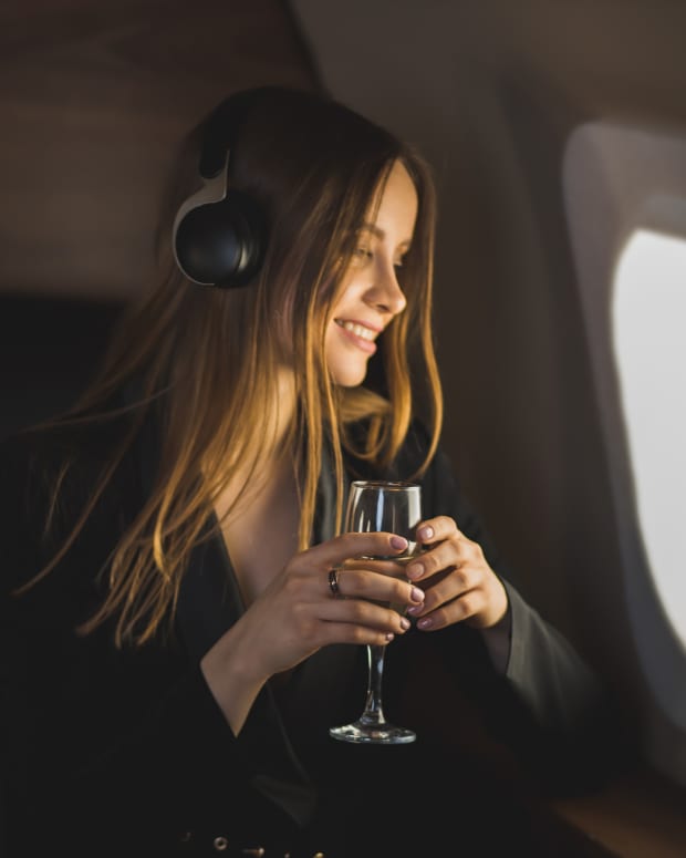 A woman enjoying her flight in first class