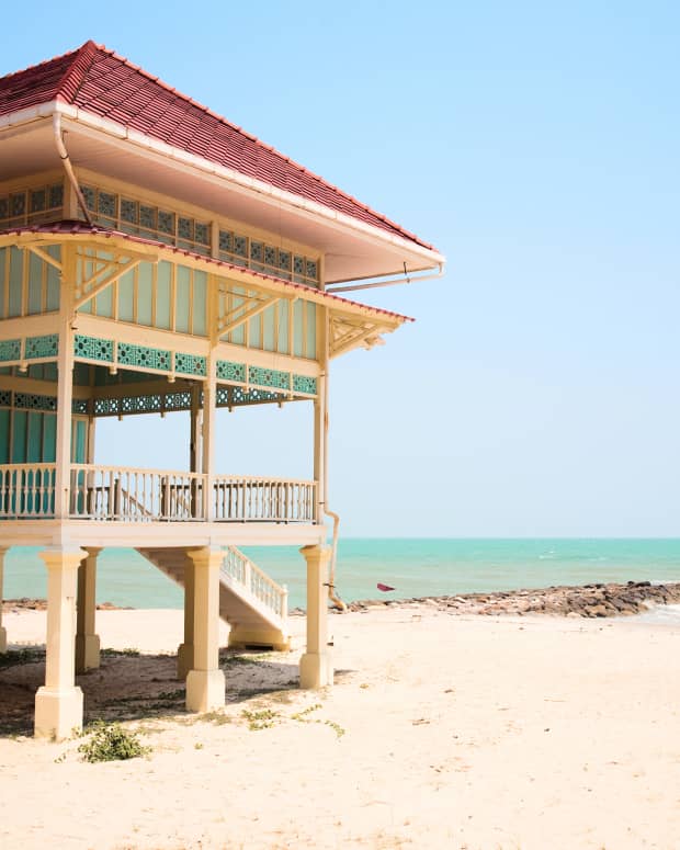 A beach house on stilts near the ocean