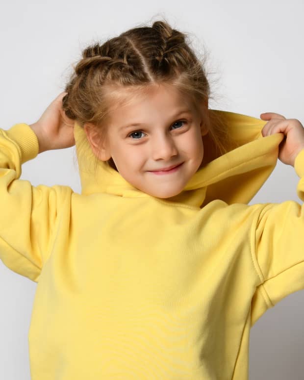 little girl in yellow hoodie