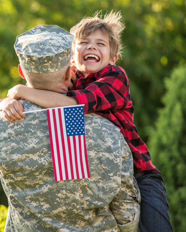 military reunion, man hugging boy