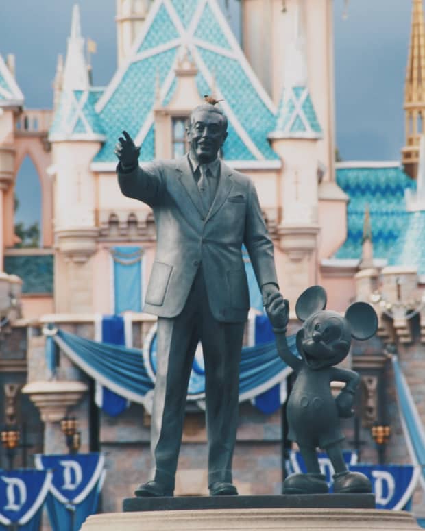 The statue of Walt Disney and Mickey Mouse outside of Disneyland California